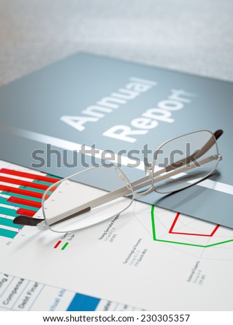Black annual report folder with graphs and charts close-up