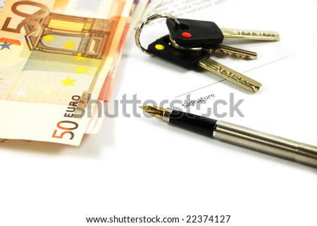 Bank notes, keys and a gold-nibbed pen on a document. Mortgage concept.