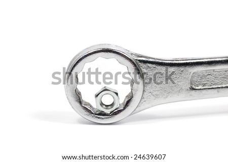 Wrong tool: big wrench with little nut. Competence concept.