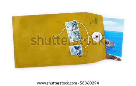 Open paper envelope with sea holiday postcard inside isolated on white background