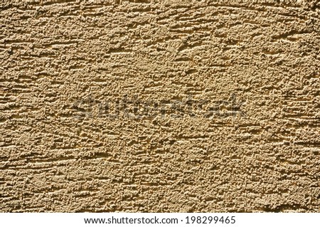 Modern grainy sandy-yellow stucco texture