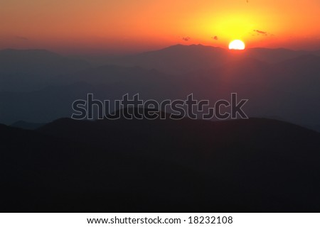 Sunset just going down over the blueridge mountains in North Carolina - lots of copy space