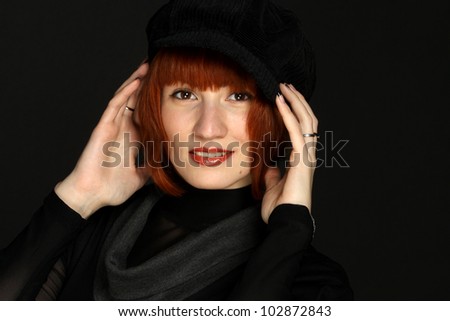 Portrait elegant woman in black hat and dress black