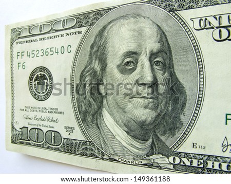 This photo illustration of Ben Franklin with a black eye on a one hundred dollar bill might illustrate a tough economy, inflation, unemployment or economic recession,or budget cuts etc.