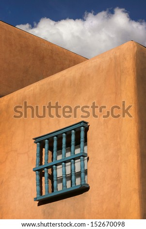 This is a simple architectural study under the warm sunlight and clear skies of Santa Fe New Mexico in early spring.