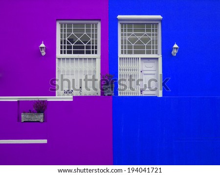 Part of the wall of the house. Doors to balcony. Bright colors. Purple and blue. Bo-Kaap. Malay Quarter. Cape Town. South Africa