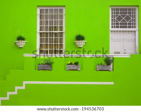 Part of the wall of the house. Porch. The front facade of the house. Bright colors. Green. Bo-Kaap. Malay Quarter. Cape Town. South Africa