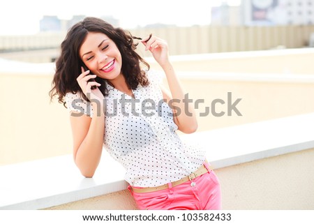 beautiful women talking on mobile and laughing