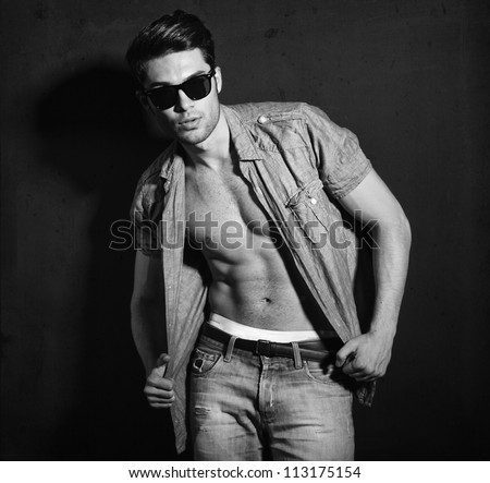 Vintage stylized black and white photo of young male model (Photo has an intentional film grain)