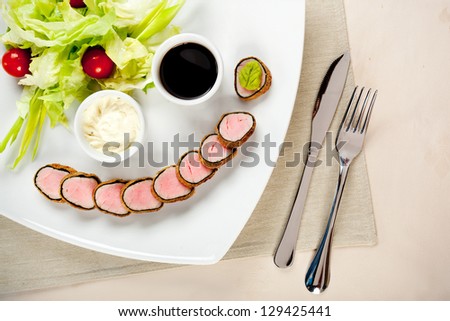 delicious sushi dish with knife and fork