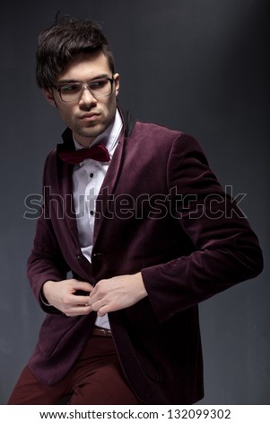sexy fashion male model dressed elegant - casual posing against wall