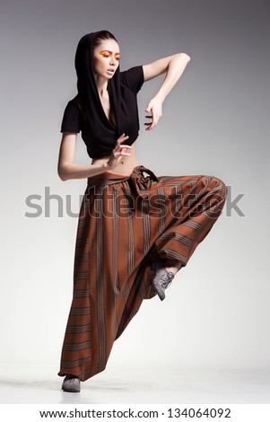sexy woman model posing in large (salwar) pants - studio fashion shot