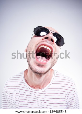  - stock-photo-funny-guy-wearing-sunglasses-screaming-fish-eye-shot-139485548