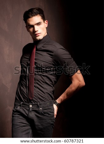 portrait of a attractive young male model serious attitude - studio shoot