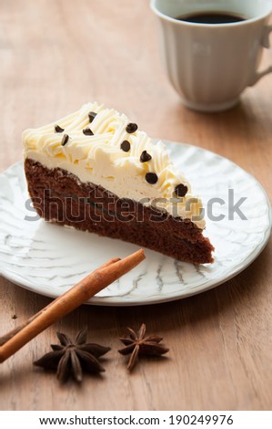 Slice piece of vanilla cake topping with white chocolate chips for coffee or tea break, an image isolated on white