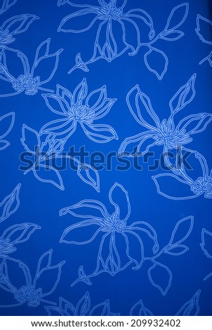 An exotic blue color  floral pattern weaved fabric as textural background.