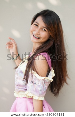 Asian woman thinking in looking pensive and happy in casual clothes isolated on white background.