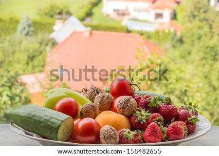 Fruits and vegetable on a bowl in summer