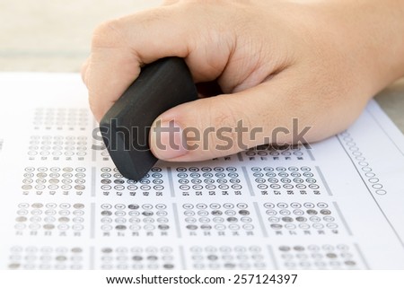 Standardized test form with answers bubbled in and a rubber