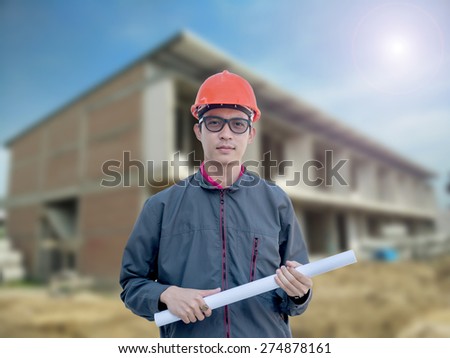 Engineers stands at a housing construction.