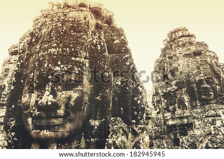 Siem Reap, Cambodia - October 23, 2013: Faces of Bayon in the summer time was the most popular among tourists to see.