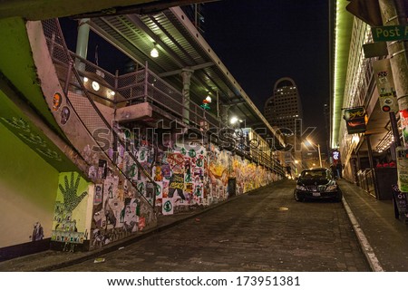 Seattle, USA, JANUARY 2014: A dark alleyway next to the Farmers market in Seattle downtown. The area is dominated by tourists. January 18, 2014