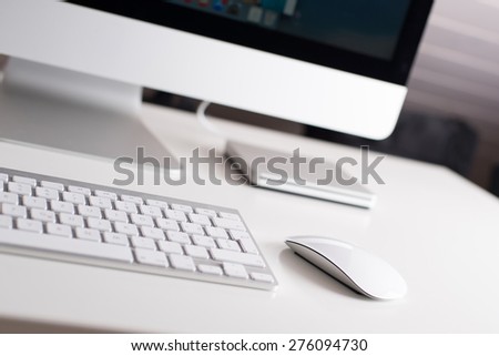 Desktop monitor with a wireless keyboard, mouse and dvd drive