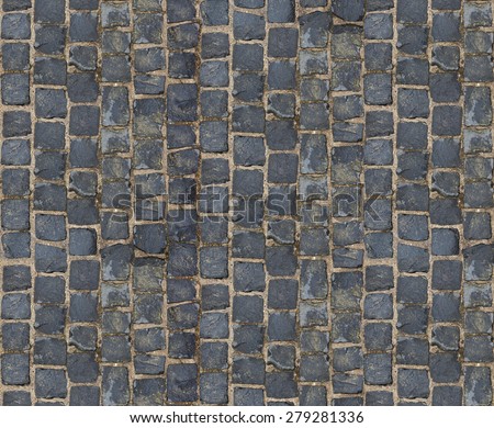 Stone pavement texture. Granite cobblestoned pavement background. Abstract background of old cobblestone pavement close-up.
