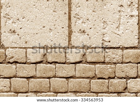 Stone pavement texture. Granite cobblestoned pavement background. Abstract background of old cobblestone pavement close-up. / Perfect tiled texture