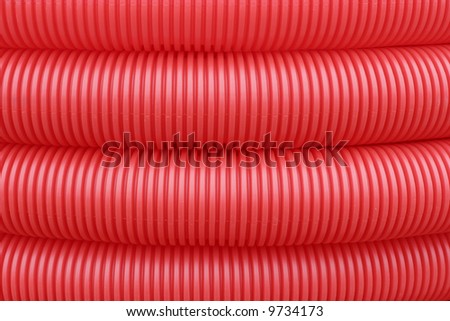 it is a macro of a red plastic pipe
