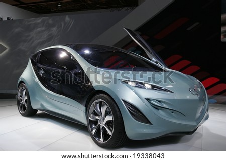 PARIS - OCTOBER 13 : People look at the Mazda concept car at the 2008 Paris Motor Show October 13, 2008 in Paris. The show attracts more of one million people every 2 years
