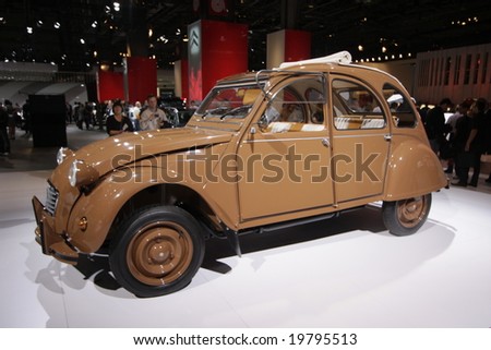 PARIS - OCTOBER 13 : People look at the Citroen 2CV Hermes at the 2008 Paris Motor Show October 13, 2008 in Paris. The show attracts more of one million people every 2 years