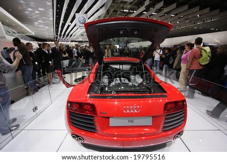PARIS - OCTOBER 13 : People look at the Audi R8 at the 2008 Paris Motor Show October 13, 2008 in Paris. The show attracts more of one million people every 2 years