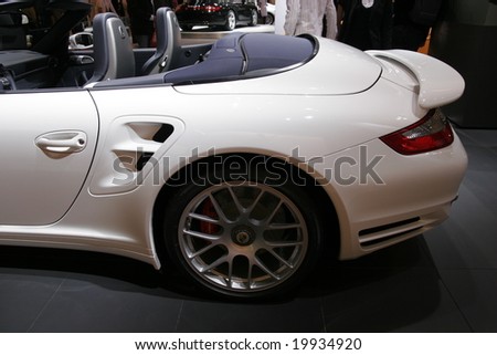 PARIS - OCTOBER 13 : People look at the Porsche roadster turbo at the 2008 Paris Motor Show October 13, 2008 in Paris. The show attracts more of one million people every 2 years