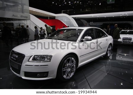 PARIS - OCTOBER 13 : People look at the Audi S8 at the 2008 Paris Motor Show October 13, 2008 in Paris. The show attracts more of one million people every 2 years