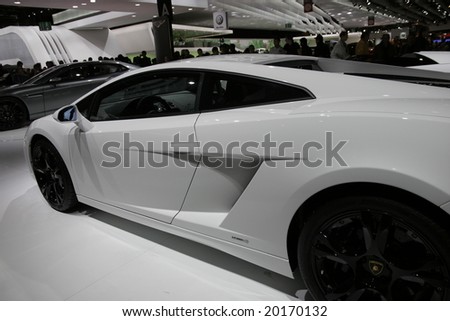 PARIS - OCTOBER 13 : People look at the Lamborghini Galardo at the 2008 Paris Motor Show October 13, 2008 in Paris. The show attracts more of one million people every 2 years