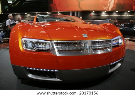 PARIS - OCTOBER 13 : People look at the crysler concept car at the 2008 Paris Motor Show October 13, 2008 in Paris. The show attracts more of one million people every 2 years
