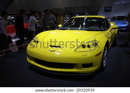 PARIS - OCTOBER 13 : People look at the corvette at the 2008 Paris Motor Show October 13, 2008 in Paris. The show attracts more of one million people every 2 years