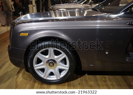 PARIS - OCTOBER 13 : People look at the rolls royce at the 2008 Paris Motor Show October 13, 2008 in Paris. The show attracts more of one million people every 2 years