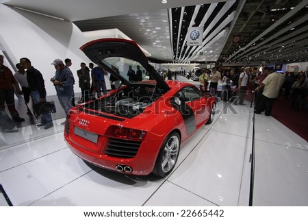 PARIS - OCTOBER 13 : People look at the Audi R8 at the 2008 Paris Motor Show October 13, 2008 in Paris. The show attracts more of one million people every 2 years