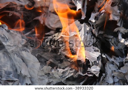 some papers burns in a big fire
