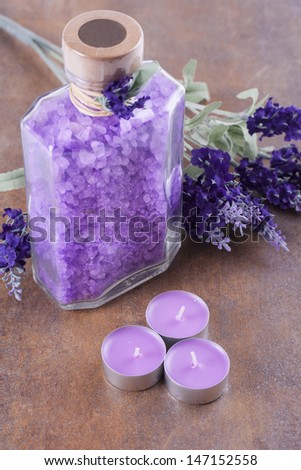 Aromatherapy and relaxation - colorful lavender bath salt in a glass