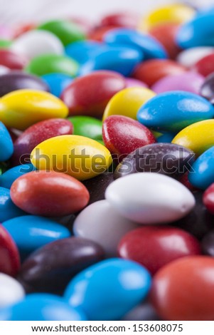 Abstract candies close up photo - multicolor smarties.