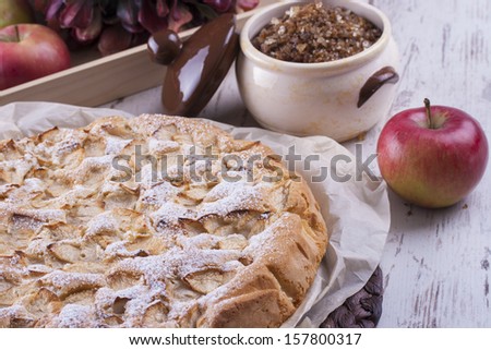 Sweet dessert rounded apple cake on the cooking paper