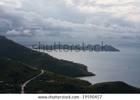 Mediterranean, narrow, seaside road among mountains