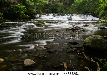 A waterfall on a small river.  Dingman\'s Creek, Delaware Water Gap National Recreation Area, PA, USA.