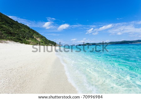 Clear blue coral water lapping white sand tropical beach on the deserted island, Kerama Islands, Okinawa, Tropical Japan