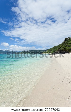 Clear blue turquoise water lapping white sand tropical beach on coral island, Amami Islands, Kagoshima, Japan