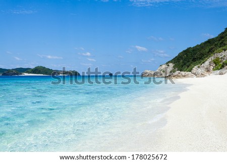 Clear blue tropical water lapping on a deserted white sandy beach of a southern Japanese island, Okinawa