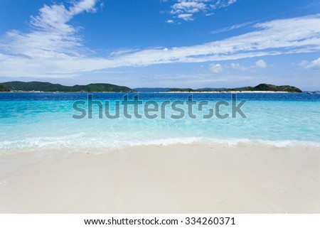 Clear blue tropical water wave lapping on white sand tropical beach, Zamami Island of the Kerama Islands National Park, Okinawa, Japan